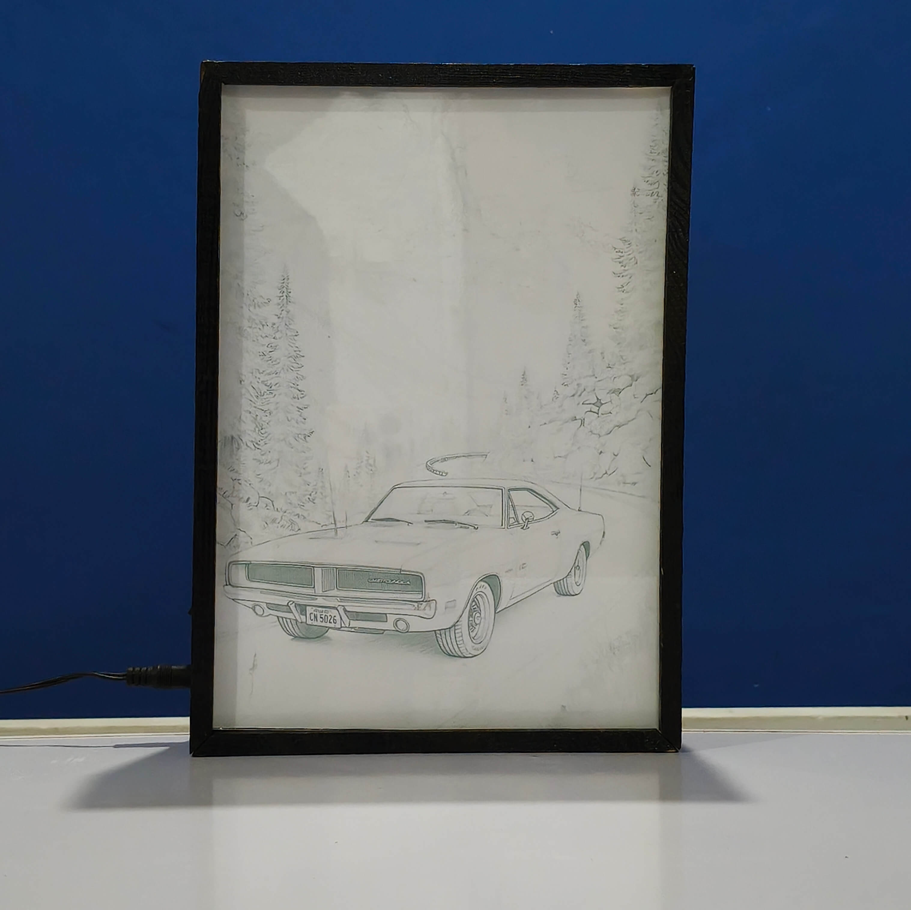 Framed drawing of a classic 1960 dodge car in a forest on a blue background Sketch backlit frame